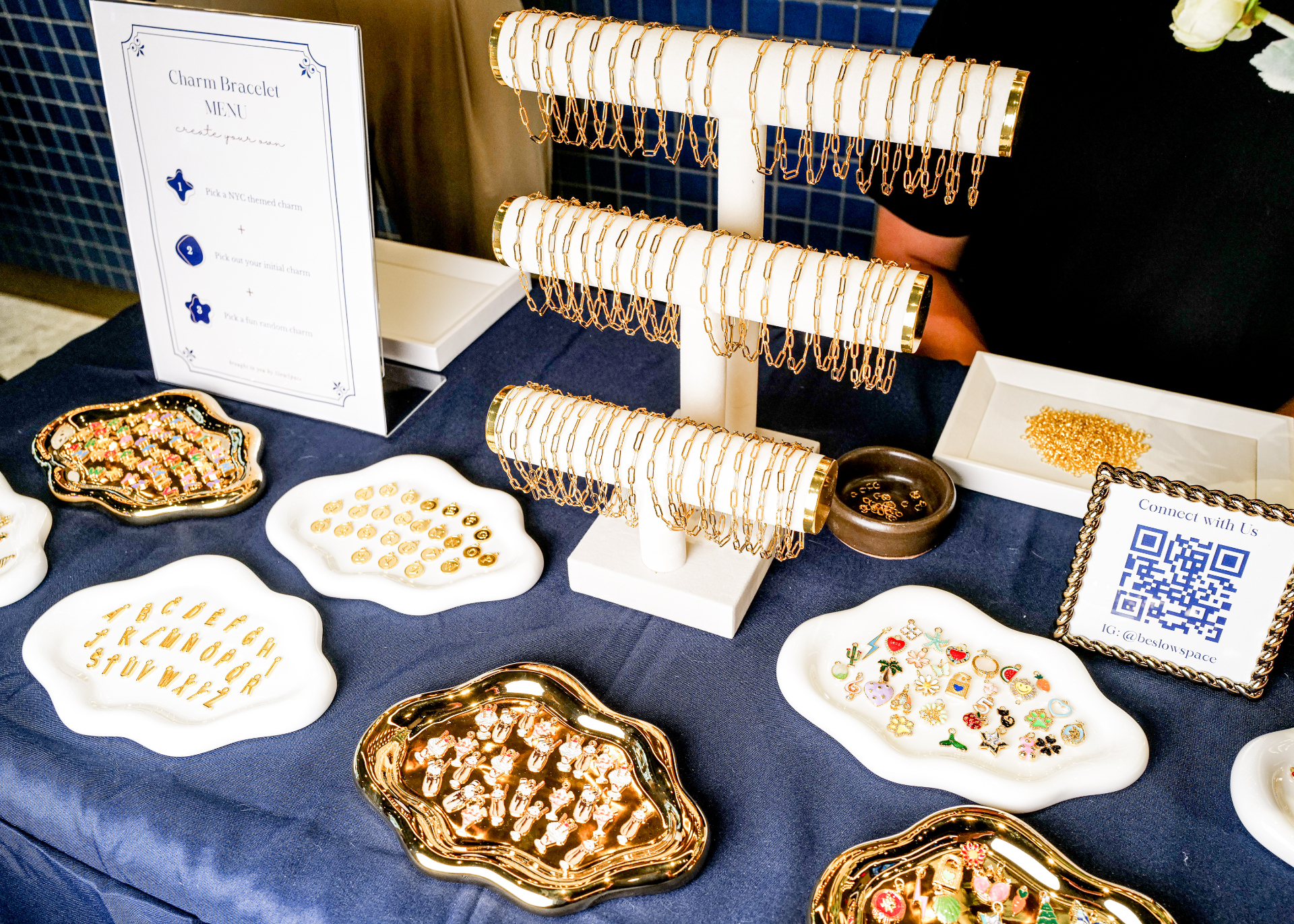 brand activation table with gold bracelet display