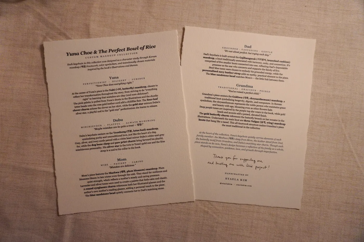 Printed artist story cards for a custom maedeup collection, laid on linen with deckled paper edges and a handwritten thank-you note.