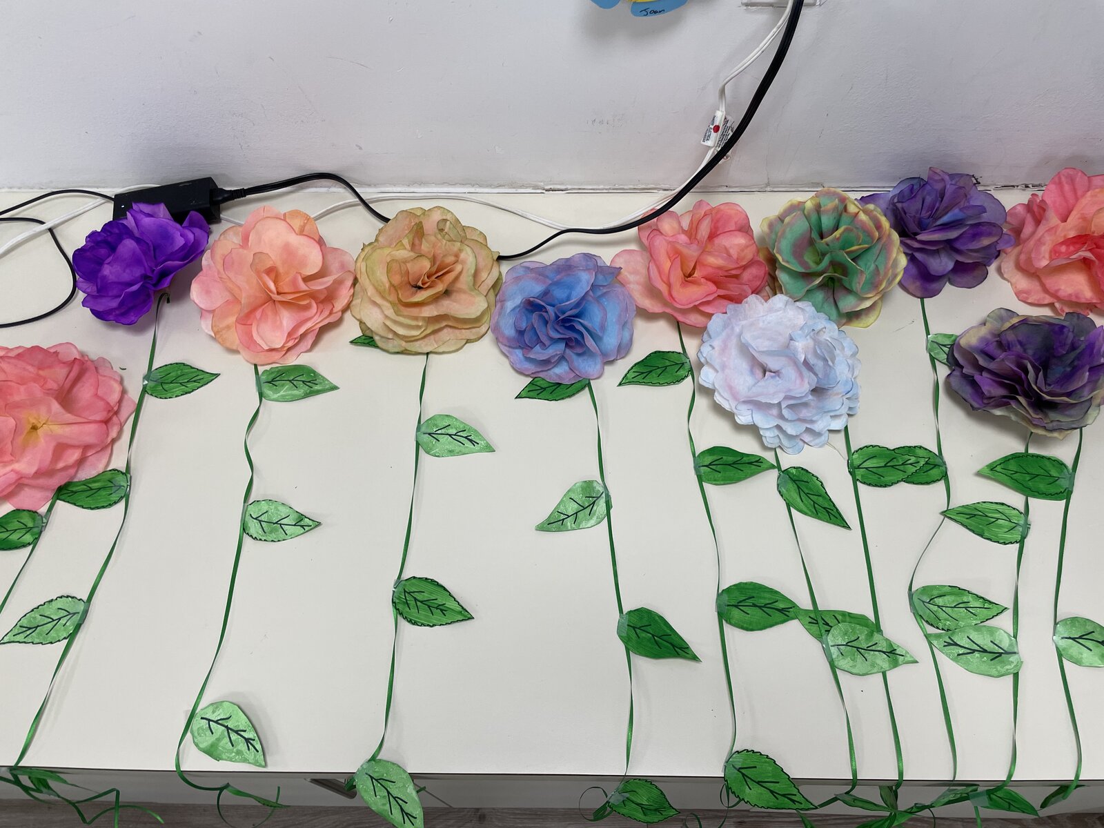 paper rose artwork made by senior artists