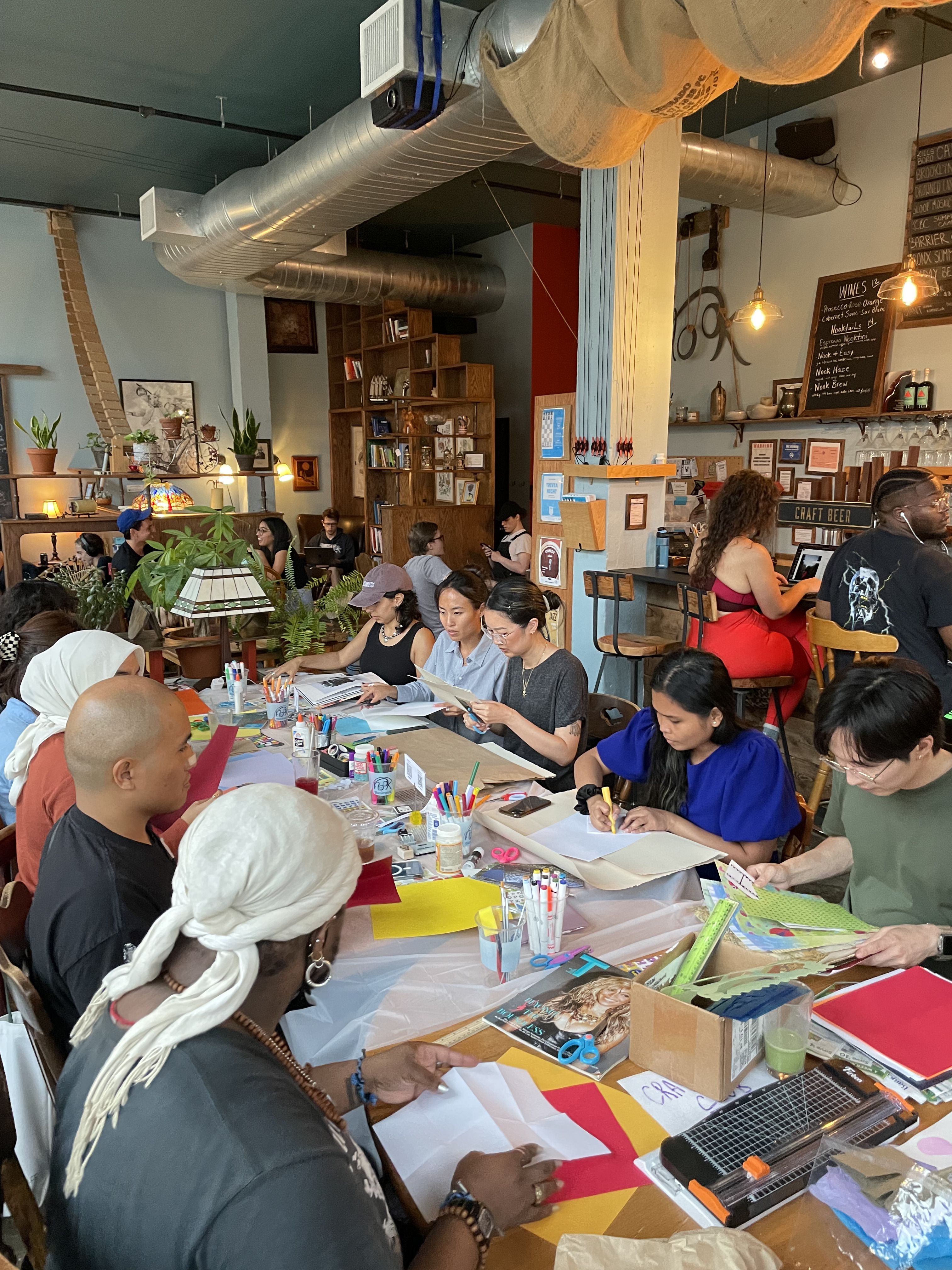 attendees gathered around a long workshop table