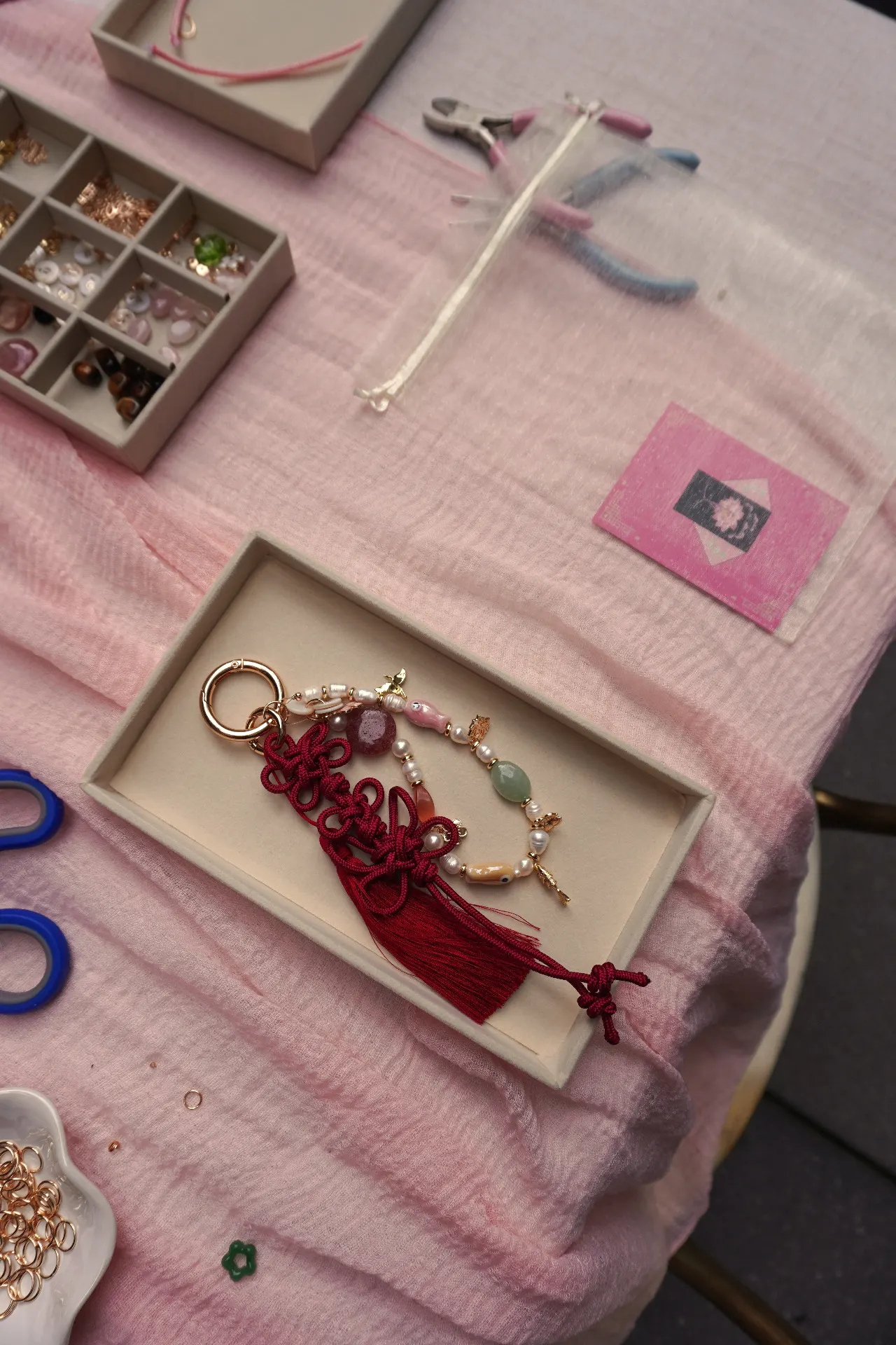 Finished norigae-inspired bag charm made at a staela kim corporate workshop in NYC.